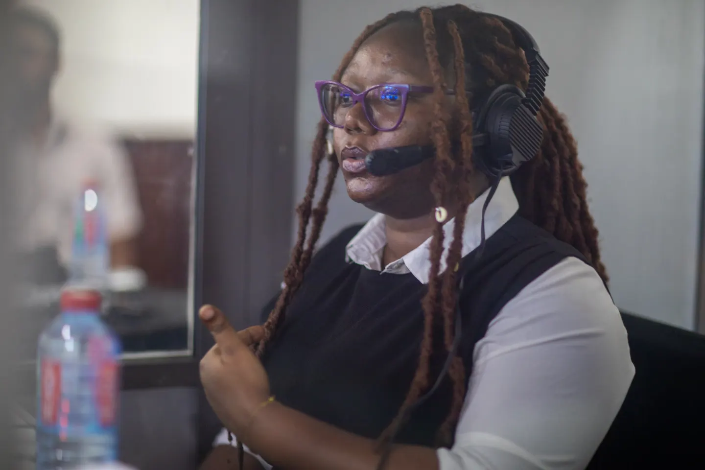 An interpreter at work in the interpretation booth at AFRINIC-37
